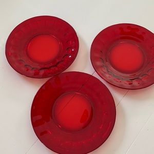 Three ruby red 8” plates